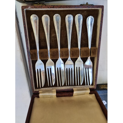 197 - Five cases of various cutlery to include a set of six hallmarked Sheffield silver handled knives