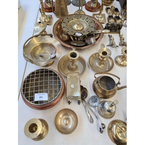 201 - A large collection of various metalware to include brass candlesticks, pair of brass eagle figurines... 