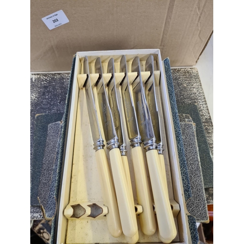 203 - Two boxes containing a large quantity of cutlery