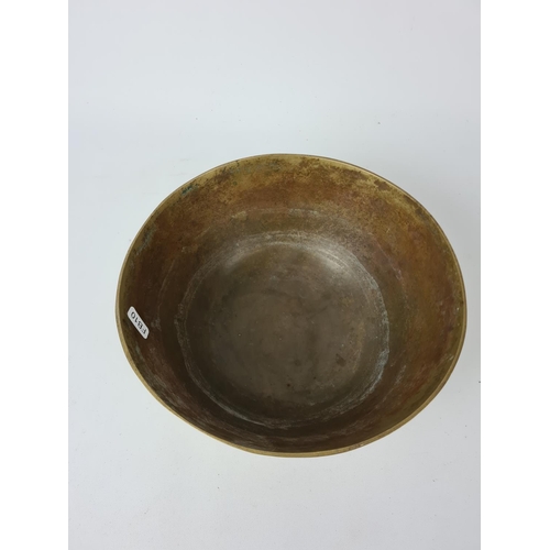 204 - An early 20th century Chinese brass bowl - approx. 25cm diameter