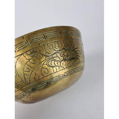 204 - An early 20th century Chinese brass bowl - approx. 25cm diameter