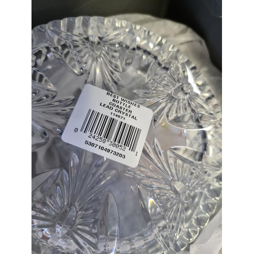 209 - A collection of various glassware to include a Waterford crystal best wishes bottle coaster, five vi... 