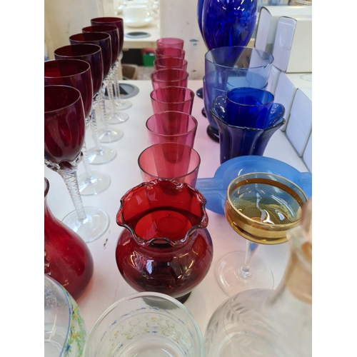 214 - Assorted glassware to include ruby red sherry glasses with twisted stem, cranberry glass beakers, Mu... 