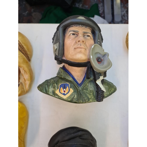 218 - Fifteen Bossons heads chalk wall plaques to include USAF fighter pilot from 'Operation Desert Storm'... 