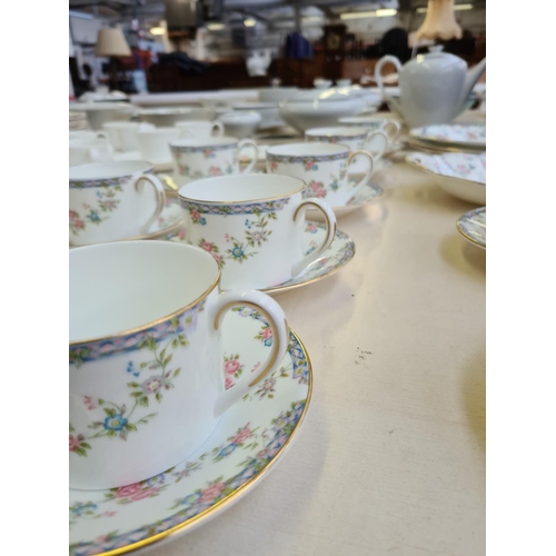 232 - A 26 piece Coalport Trellis Rose part tea set comprising 10 tea cups, 12 saucers, 3 cake plates and ... 