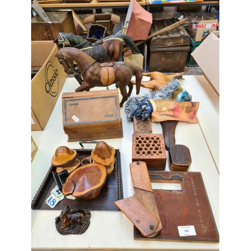 259 - A collection of various items to include a vintage leather bridge set, two leather horse figurines, ... 