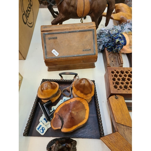 259 - A collection of various items to include a vintage leather bridge set, two leather horse figurines, ... 