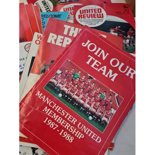 263 - A large collection of 1960s and 70s Manchester United football programmes and a 1966 World Cup Winne... 