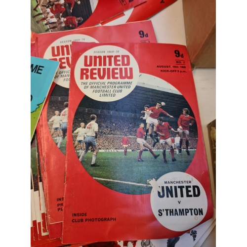 263 - A large collection of 1960s and 70s Manchester United football programmes and a 1966 World Cup Winne... 