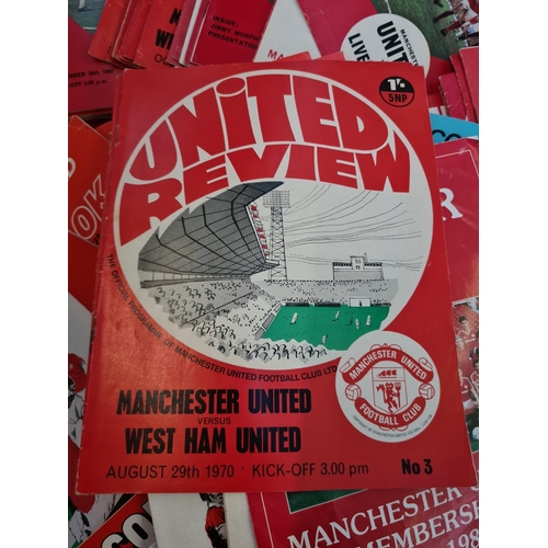 263 - A large collection of 1960s and 70s Manchester United football programmes and a 1966 World Cup Winne... 