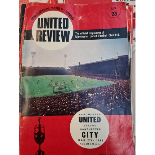 263 - A large collection of 1960s and 70s Manchester United football programmes and a 1966 World Cup Winne... 