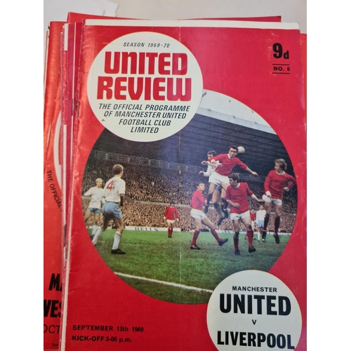 263 - A large collection of 1960s and 70s Manchester United football programmes and a 1966 World Cup Winne... 