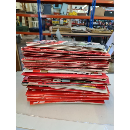 263 - A large collection of 1960s and 70s Manchester United football programmes and a 1966 World Cup Winne... 