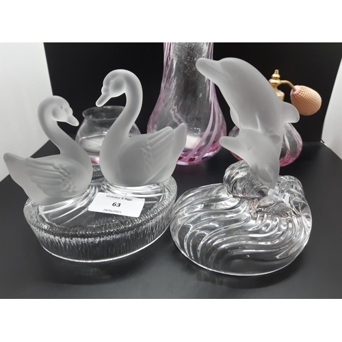 63 - Five pieces of assorted glassware to include a Lalique style dolphin, Lalique style swans and three ... 