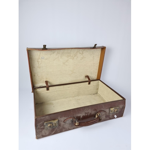 88 - A vintage brown cowhide suitcase - approx. 61cm wide x 35cm deep