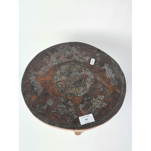 92 - A 20th century tribal style hardwood circular stool - approx. 32.5cm high x 32cm diameter