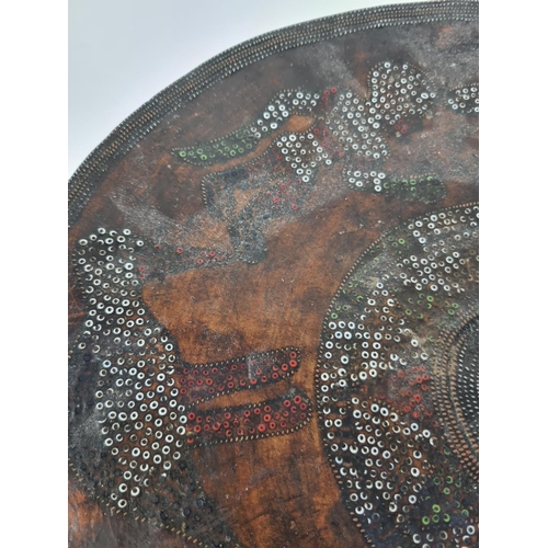 92 - A 20th century tribal style hardwood circular stool - approx. 32.5cm high x 32cm diameter