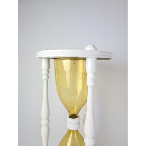 94 - A novelty oversized white painted egg timer - approx. 59cm high