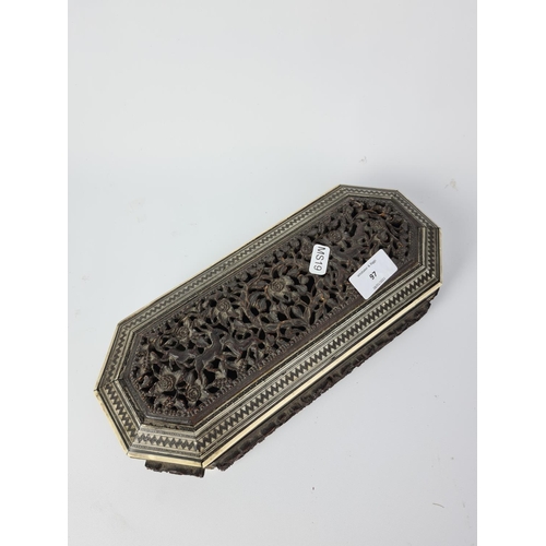 97 - A vintage Anglo Indian heavily carved glove box with hunting scene design - approx. 30cm long