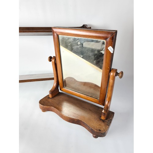 84 - Two items to include a Victorian mahogany toilet mirror and a turn of the century mahogany two tier ... 