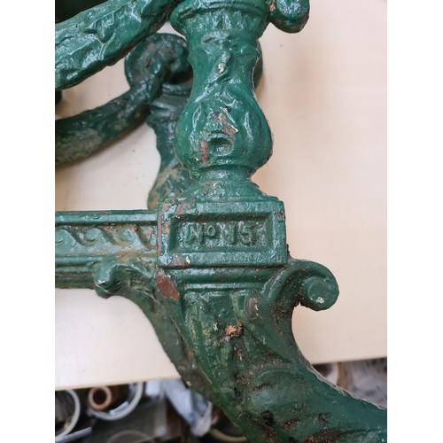 256A - A pair of 19th century Carron No.15 green painted cast iron bench ends