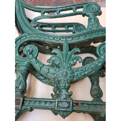 256A - A pair of 19th century Carron No.15 green painted cast iron bench ends