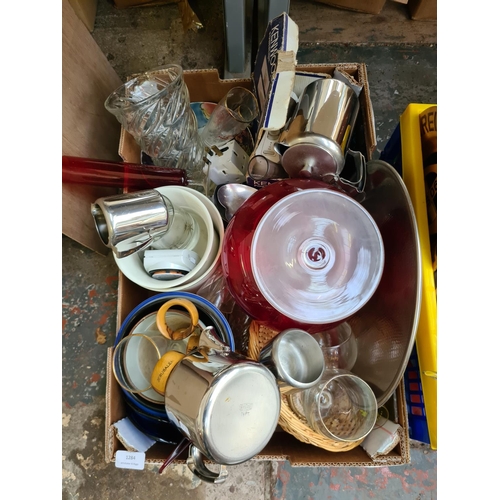 1284 - Three boxes containing red glass fruit bowl, carved wooden deer, stainless steel tea and coffee set,... 