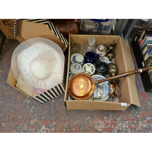 1290 - Two items, one box containing copper bed warmer, glass decanter, brass vase and one boxed ladies hat