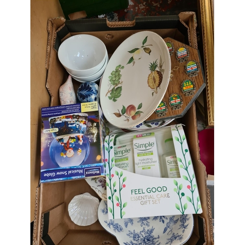 1307 - Three boxes containing crockery, unopened Simple toiletry set, boxed Merlinera musical snow globe, g... 