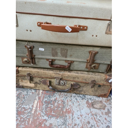 1315 - Four various vintage suitcases