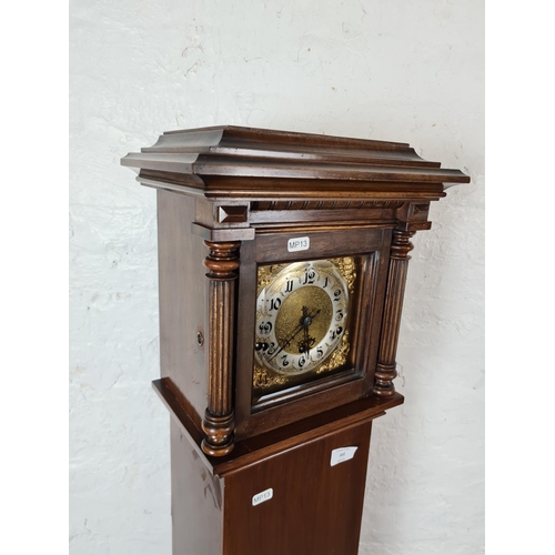 302 - A vintage mahogany cased Grandmother clock with brass face - approx. 151cm high