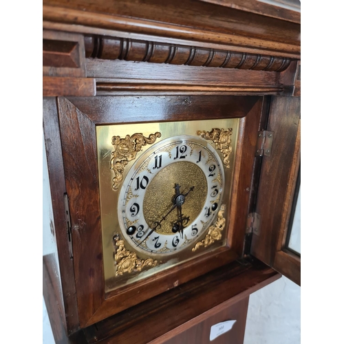 302 - A vintage mahogany cased Grandmother clock with brass face - approx. 151cm high