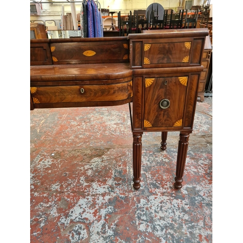 303 - A large George IV inlaid mahogany buffet/sideboard on reeded supports, circa 1825 - approx. 222cm wi... 