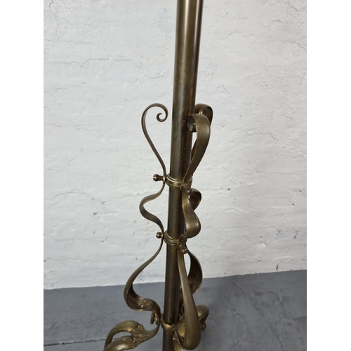 305 - An Art Nouveau brass standard lamp - approx. 163cm with shade