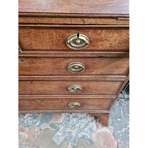 308 - A George III oak bureau - approx. 106cm wide x 54cm deep x 117cm high