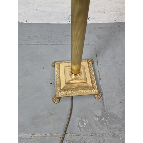 310A - A Regency style brass standard lamp - approx. 158cm with bulb