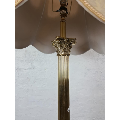 310A - A Regency style brass standard lamp - approx. 158cm with bulb