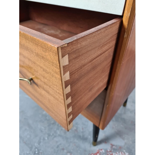 319 - A mid 20th century teak chest of drawers on atomic supports - approx. 77cm high x 78cm wide x 44cm d... 