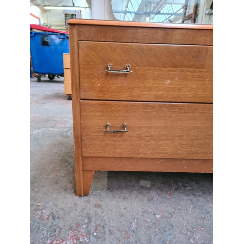 320 - A mid 20th century oak dressing chest - approx. 125cm high with mirror x 93cm wide x 41cm deep