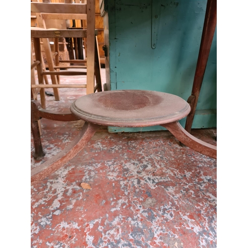 323 - An Edwardian mahogany oval two tier side table