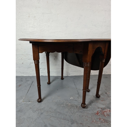 325 - An early 20th century oak drop leaf gate leg dining table - approx. 90cm wide x 121cm long x 75cm hi... 