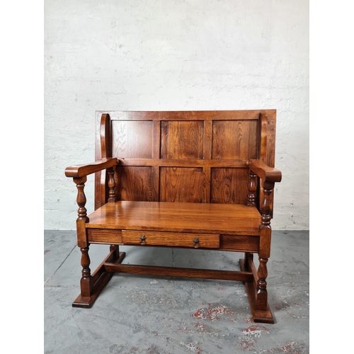 331 - A modern oak monks bench