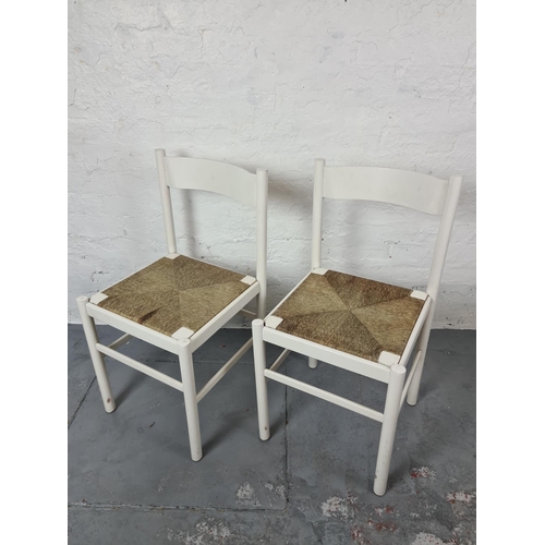 346 - A set of four mid 20th century white painted dining chairs with rush seats