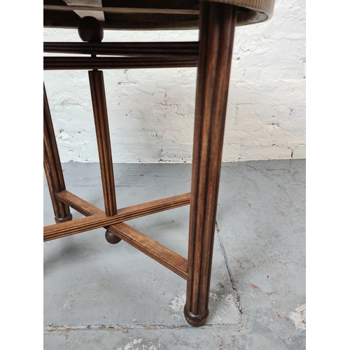 363 - A vintage oak and brass top circular folding side table