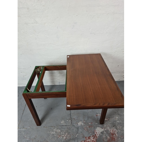 367 - A mid 20th century teak card table with green baize interior - approx. 92cm wide x 71cm high x 51cm ... 