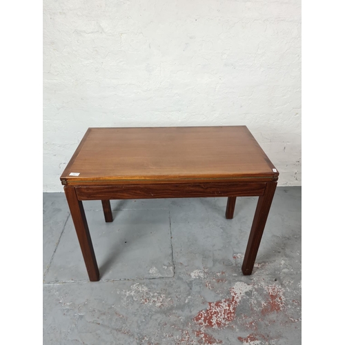 367 - A mid 20th century teak card table with green baize interior - approx. 92cm wide x 71cm high x 51cm ... 