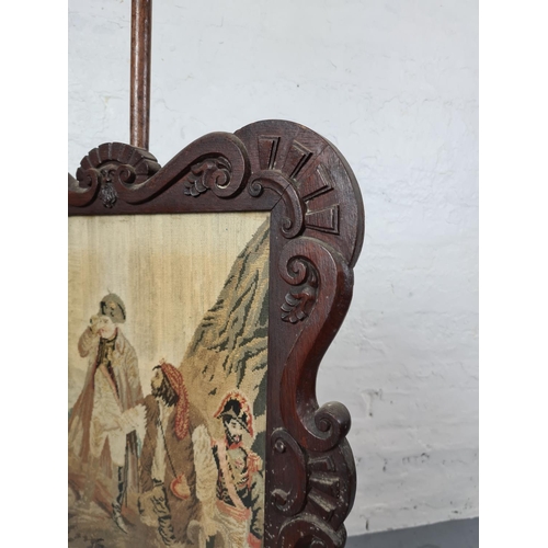 372 - A 19th century mahogany adjustable pole screen with tapestry insert and barley twist stand