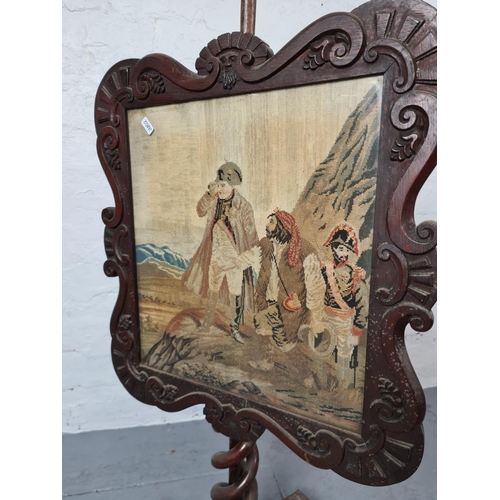 372 - A 19th century mahogany adjustable pole screen with tapestry insert and barley twist stand