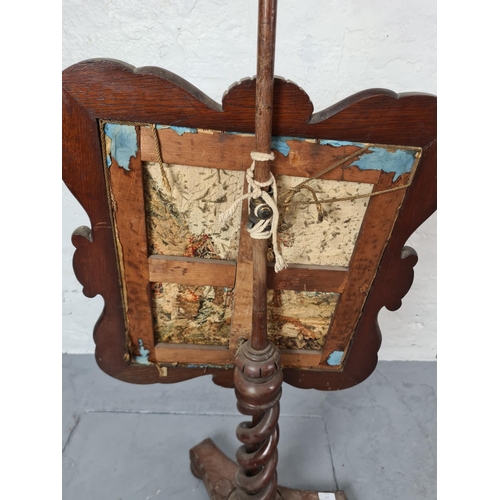 372 - A 19th century mahogany adjustable pole screen with tapestry insert and barley twist stand