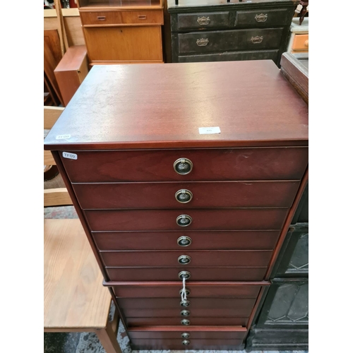 375 - A mahogany chest of drawers in the form of an Edwardian music cabinet - approx. 112cm high x 51cm wi... 